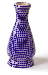 A blue vase made with tiles.